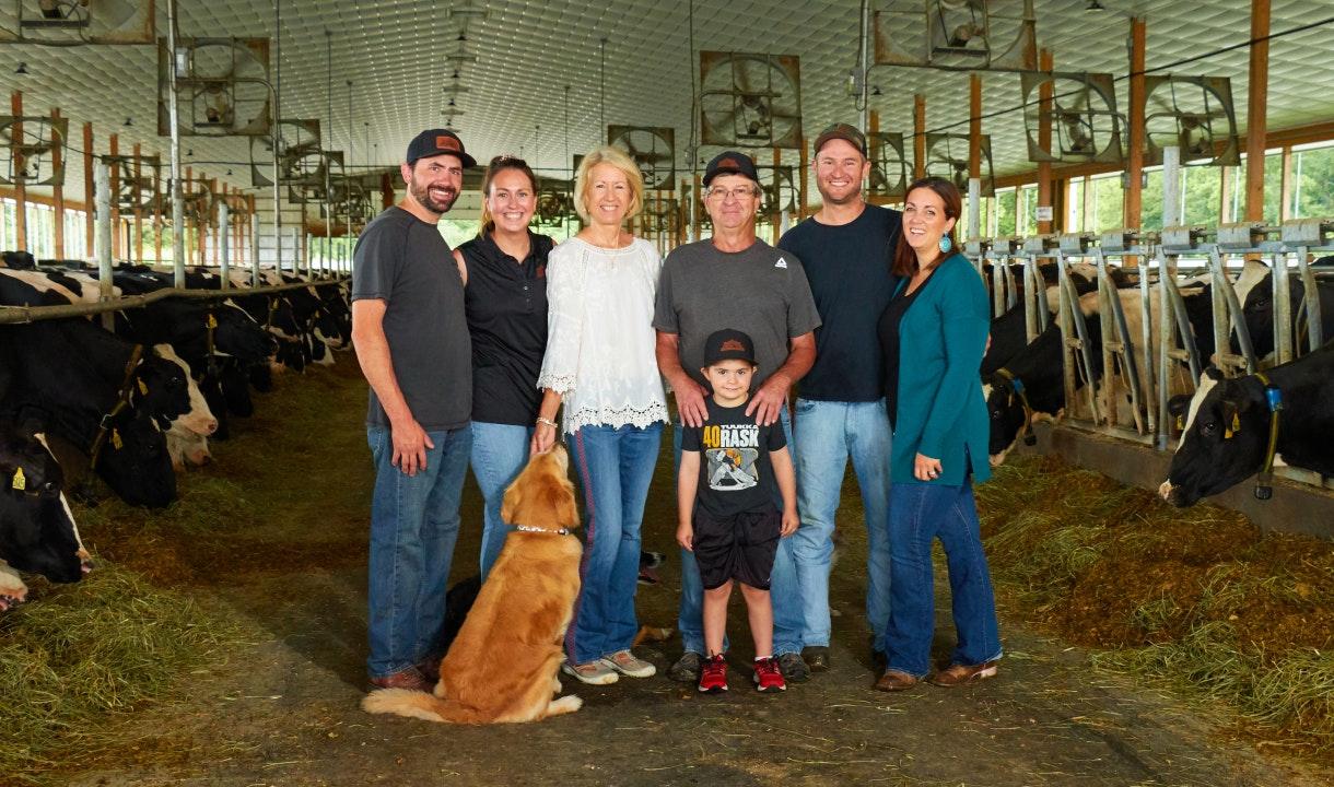 Family on a farm that uses anaerobic digestion for manure management and regenerative agriculture